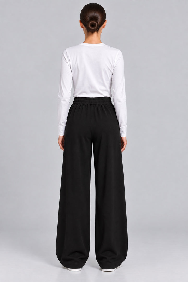 Flint | Pleated Tapered Trousers — Black (back)